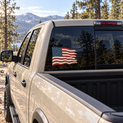 Tattered American Flag — rear window, left